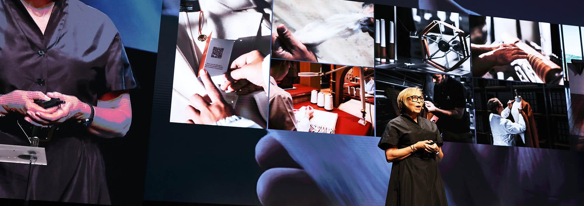 People, Person, Stage, Adult, FemAle, Woman, fashion, Clothing, Dress, Accessories, Glasses, face, Head, Advertisement, Formal Wear, Coat, Computer Hardware, Electronics, hardware, Screen, monitor, Crowd